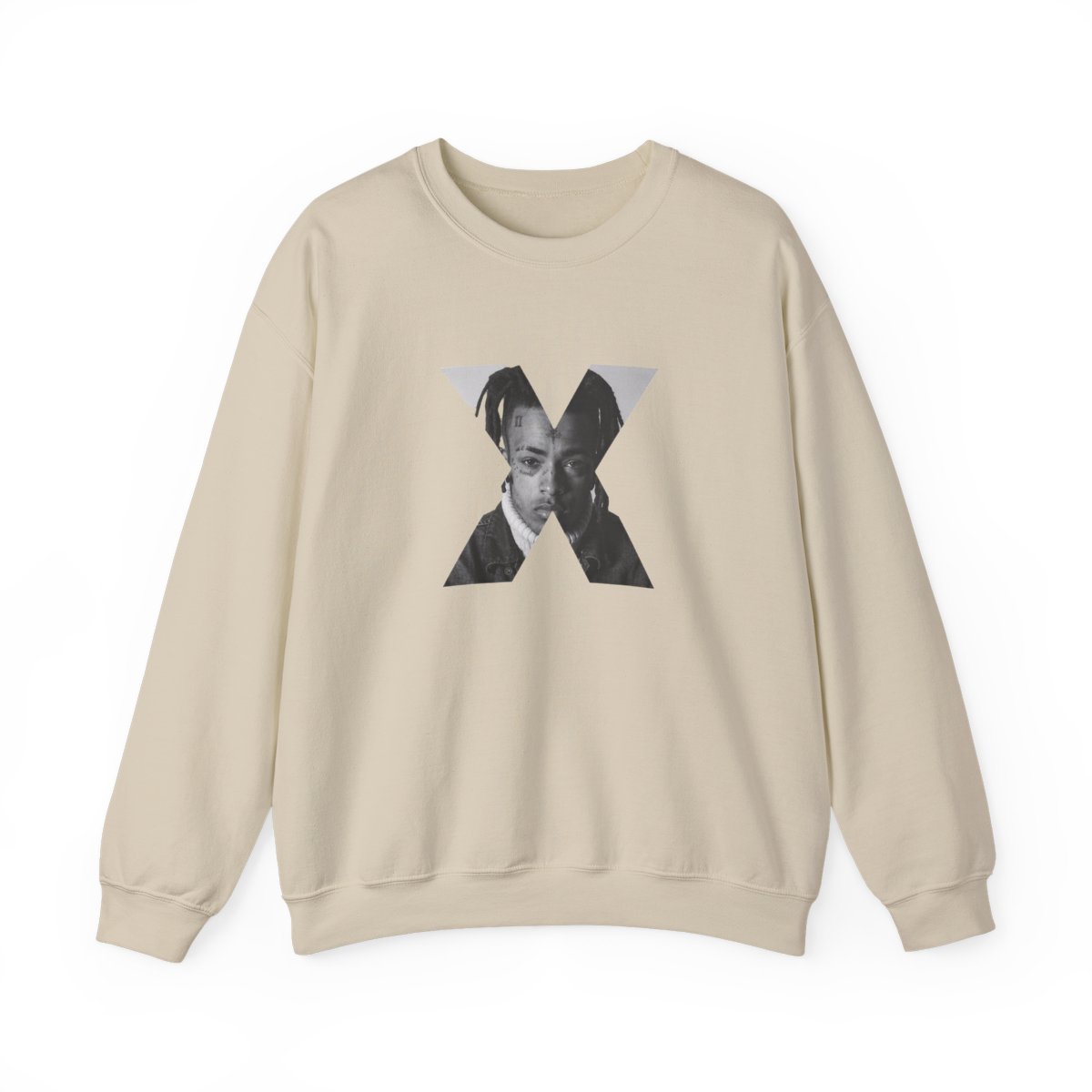 White crew neck sweatshirt with a black and white portrait of a person's face inside a grey X. The text "XXXTENTACION" is printed vertically on the left side of the X
