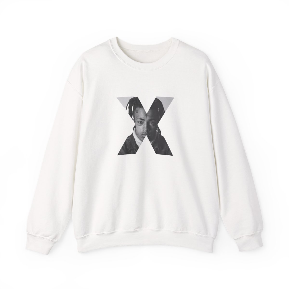 White crew neck sweatshirt with a black and white portrait of a person's face inside a grey X. The text "XXXTENTACION" is printed vertically on the left side of the X